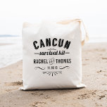 Cancun Survival Kit | Wedding Welcome Tote Bag<br><div class="desc">Greet your guests with some key wedding survival essentials (water, snacks, pain reliever, bandages, sewing kit, etc) in these cute Cancun wedding welcome bags! Design features "Cancun Survival Kit" in black vintage apothecary-style text. Personalize with your names and wedding date; use the "Customize It" button to adjust font size based...</div>