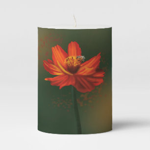 Candle with orange flower and bee