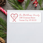 Candy Cane Heart Monogram Christmas Return Address Label<br><div class="desc">Add a touch of festive charm to your holiday mail with this candy cane heart address label! Featuring a sweet red and white candy cane design shaped into a heart with customizable family name and address text, this label is perfect for spreading holiday cheer. Whether you’re sending Christmas cards, invitations,...</div>