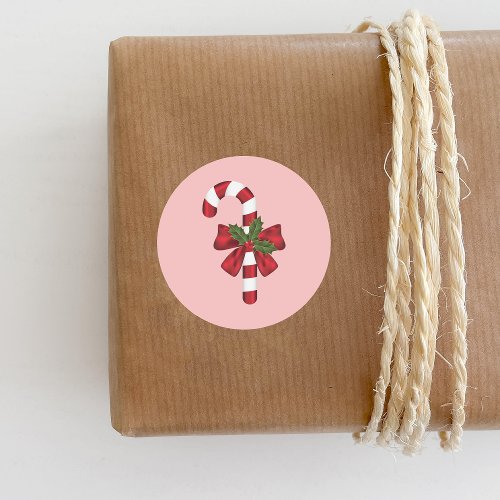 Candy Cane With A Bow And Christmas Holly On Pink Classic Round Sticker