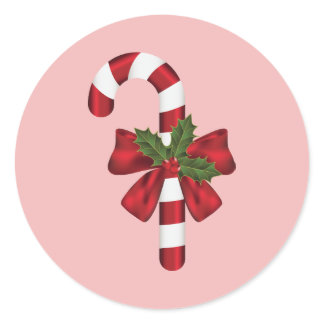 Candy Cane With A Bow And Christmas Holly On Pink Classic Round Sticker