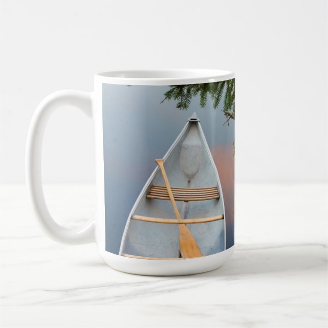 Canoe on lake at sunset, Canada Coffee Mug (Left)