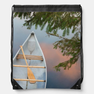Canoe on lake at sunset, Canada Drawstring Bag