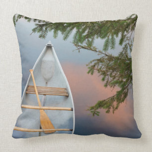 Canoe on lake at sunset, Canada Throw Pillow