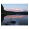 Canoe, paddle and lake at Sunset