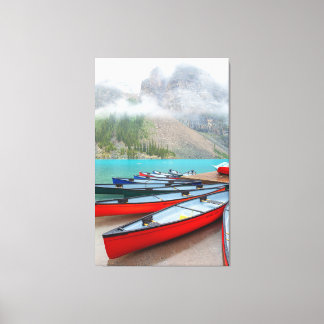 Canoes at Moraine Lake Canvas Print