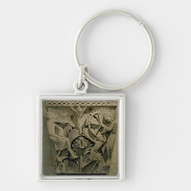 Capital depicting a man shooting an arrow into the keychain (Front)