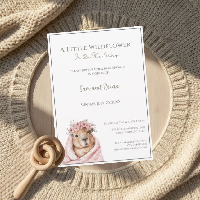 Capybara Baby Shower • Little Wildflower Invitation (warm boho invitation mockup with wooden rattle and knit details on soft neutral background)
