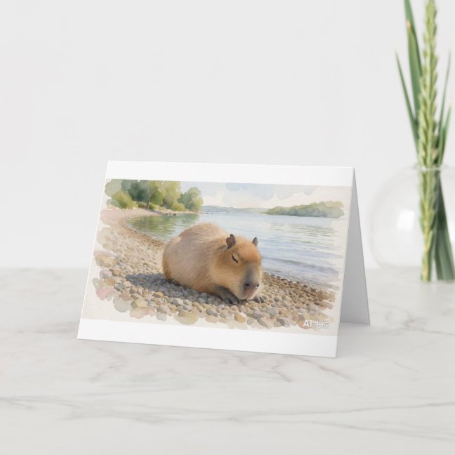 Capybara Dozing On The Lakeside Pebble Shore Greet Card