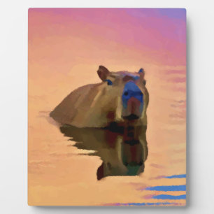 Capybara Emerging From a Tranquil Lake Plaque