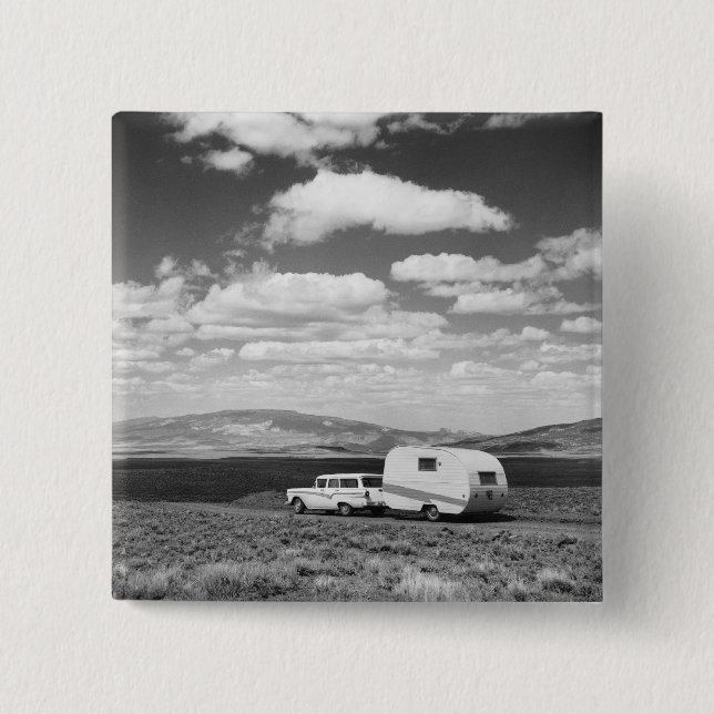 Car pulling trailer on road pinback button (Front)