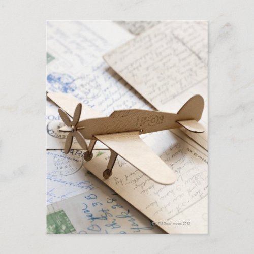 Carboard airplane on postcards