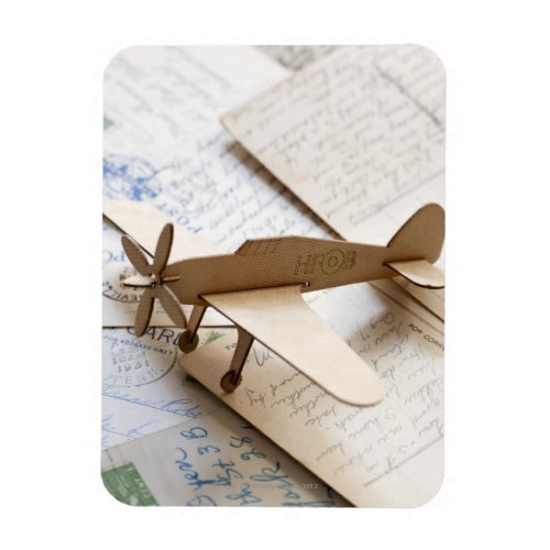 Carboard airplane on postcards magnet