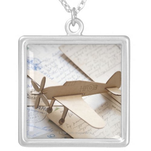 Carboard airplane on postcards silver plated necklace