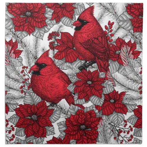 Cardinals and poinsettia in red and white cloth napkin