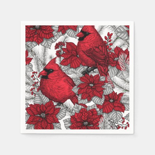 Cardinals and poinsettia in red and white napkins