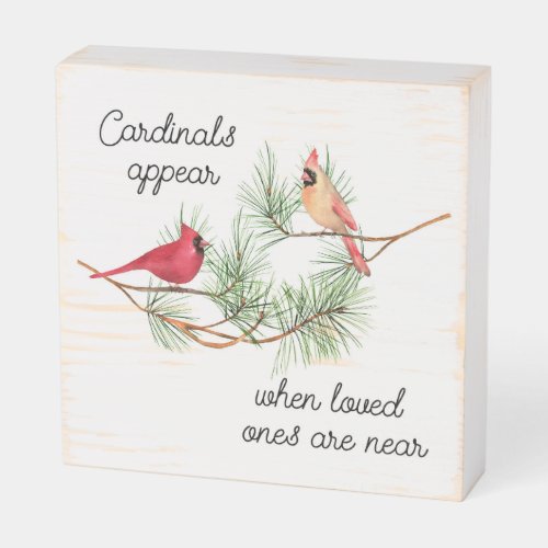 Cardinals appear when loved ones are near wooden box sign