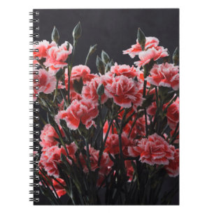 Carnation flowers bouquet vintage color toned over notebook