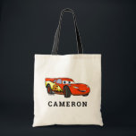 Cars Lightning McQueen Smiling Disney Tote Bag<br><div class="desc">Carry the excitement of Radiator Springs with the Cars Lightning McQueen Smiling Disney Tote Bag! Featuring Lightning McQueen with his signature confident smile, this bold and colorful design is perfect for fans of Disney Pixar’s Cars. Whether for everyday use, shopping, or as a fun accessory, this tote bag brings high-speed...</div>