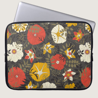 cartoon leaves and flowers on a dark background in laptop sleeve
