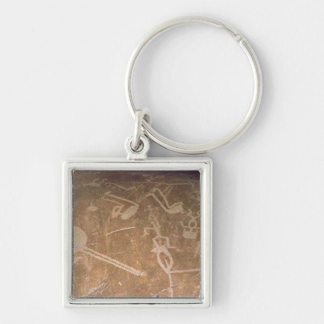 Carved petroglyph depicting figures keychain (Front)