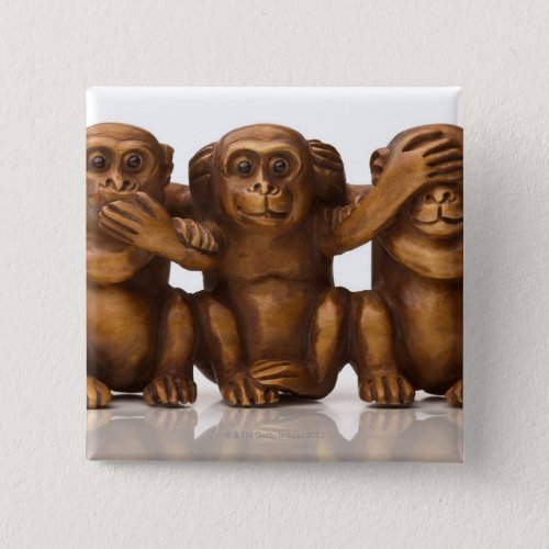 Carving of three wooden monkeys pinback button
