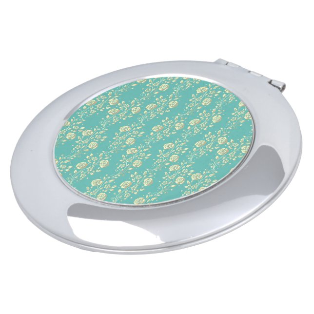 Cascading gold flowers on teal compact mirror (Turned)