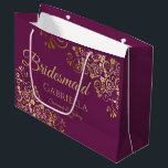 Cassis Purple & Gold Lace Elegant Bridesmaid Large Gift Bag<br><div class="desc">This beautiful gift bag is designed as a wedding gift or favor bag for Bridesmaids. It features an elegant cassis purple, magenta, or berry and gold design with golden lace frills in the corners the text "Bridesmaid" as well as a place to enter her name, the couple's name, and the...</div>