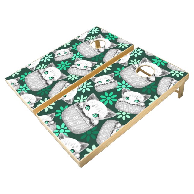Cat Cute and Playful peaking from a Pocket Cornhole Set (Angled)