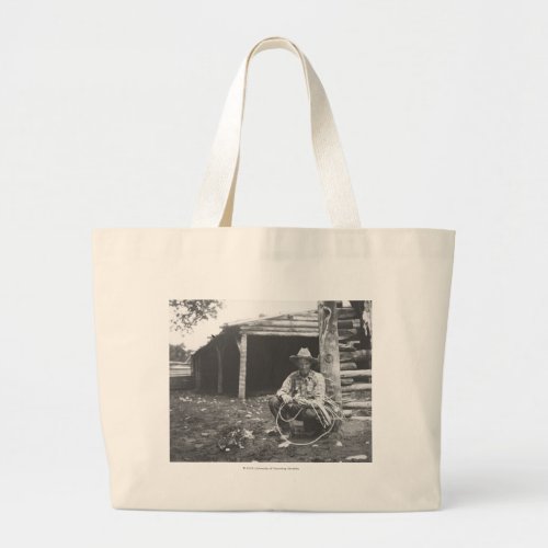 Cat eating out of a coffee can large tote bag