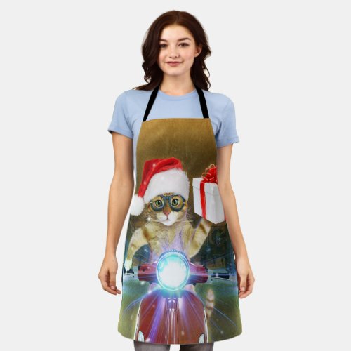Cat in the Santa Claus hat delivers Christmas gift Apron