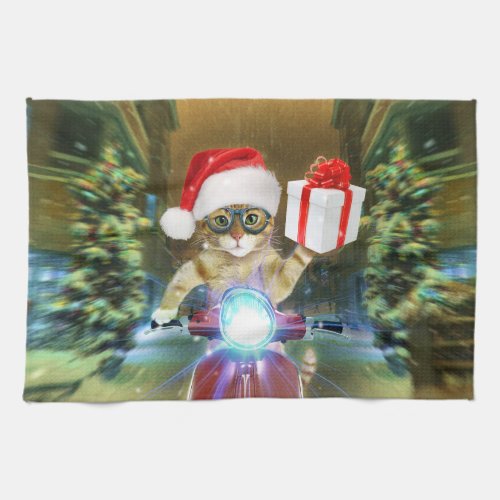 Cat in the Santa Claus hat delivers Christmas gift Kitchen Towel
