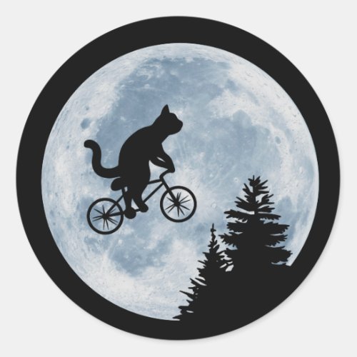 Cat is riding bicycle on the moon background classic round sticker