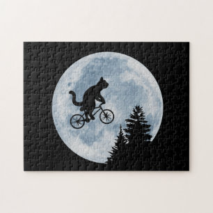 Cat is riding bicycle on the moon background. jigsaw puzzle