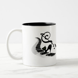 Cat on a Piano keyboard playing music coffee mug