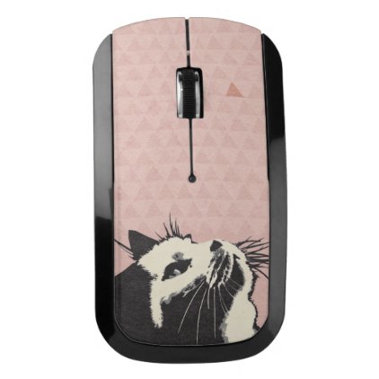 Cat on pink playing wireless mouse
