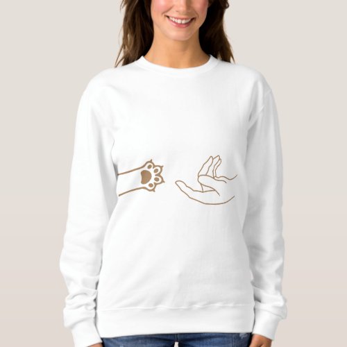Cat paw human hand in gold color on white sweatshirt