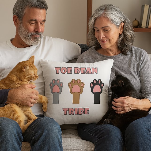 Cat Paws Toe Bean Tribe Throw Pillow (A throw pillow with three cat paws and the words toe bean tribe.)