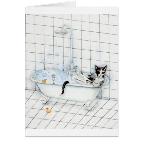 Cat reading newspaper in the bathtub