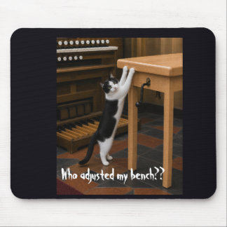 Cat scratching an organ bench mouse pad
