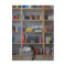 Cat sleeping in bookshelf library books