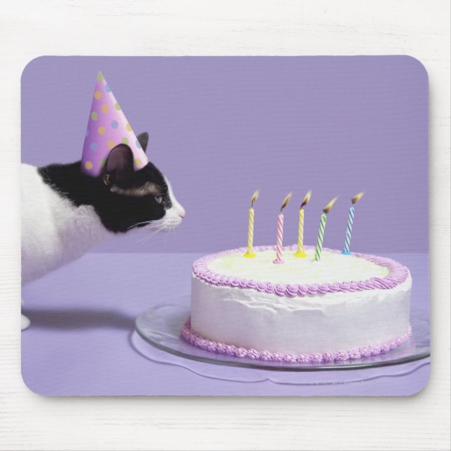 Cat wearing birthday hat blowing out candles mouse pad (Front)