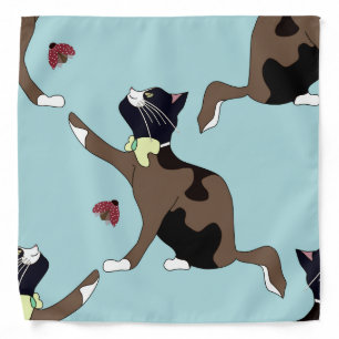 Cat with a bow catches a ladybug. bandana