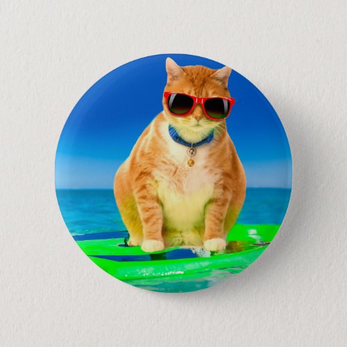 Cat with sunglasses surfing in the ocean button