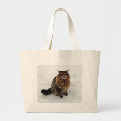 Catching a snowflake large tote bag