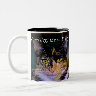 "Cats defy the ordinary" Coffee Mug