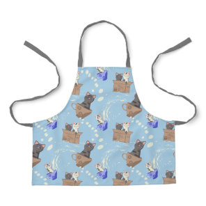 Cats in box and milk drops on blue apron