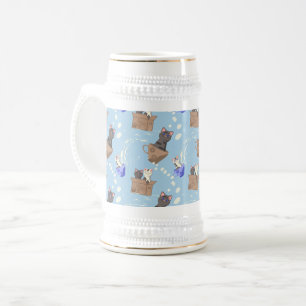 Cats in box and milk drops on blue beer stein