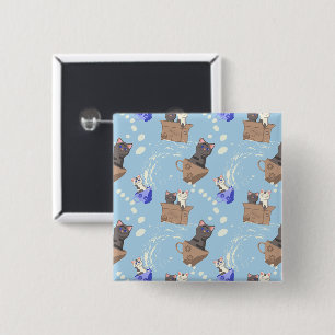 Cats in box and milk drops on blue button