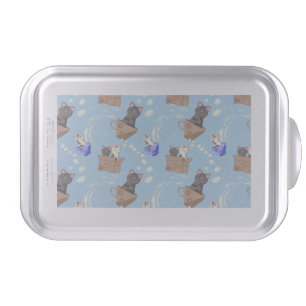 Cats in box and milk drops on blue cake pan